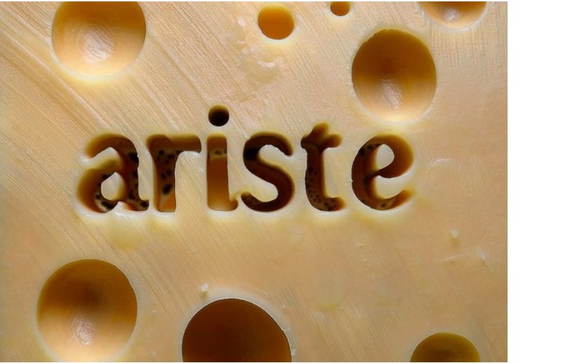 Ariste wordmark cut into cheese