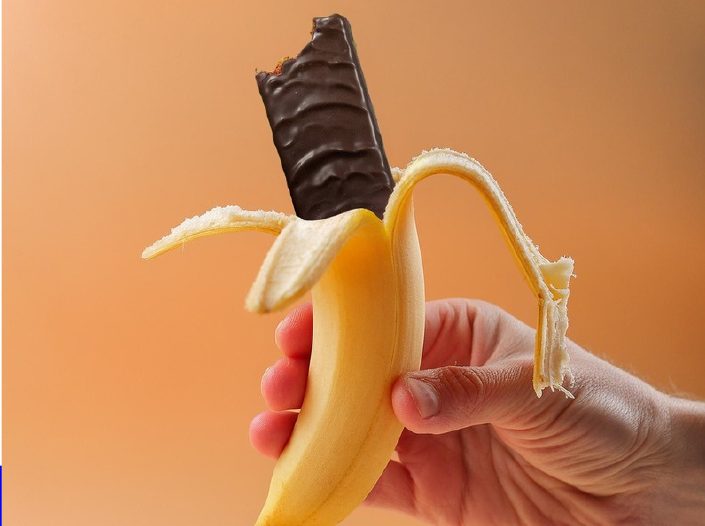 Delly bar tucked into a peeled banana